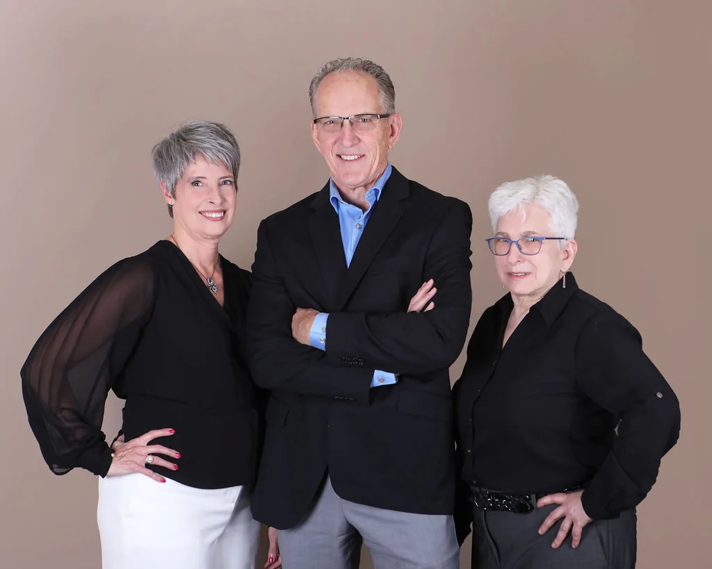 Three Ontario Hearing Center team members professional portrait