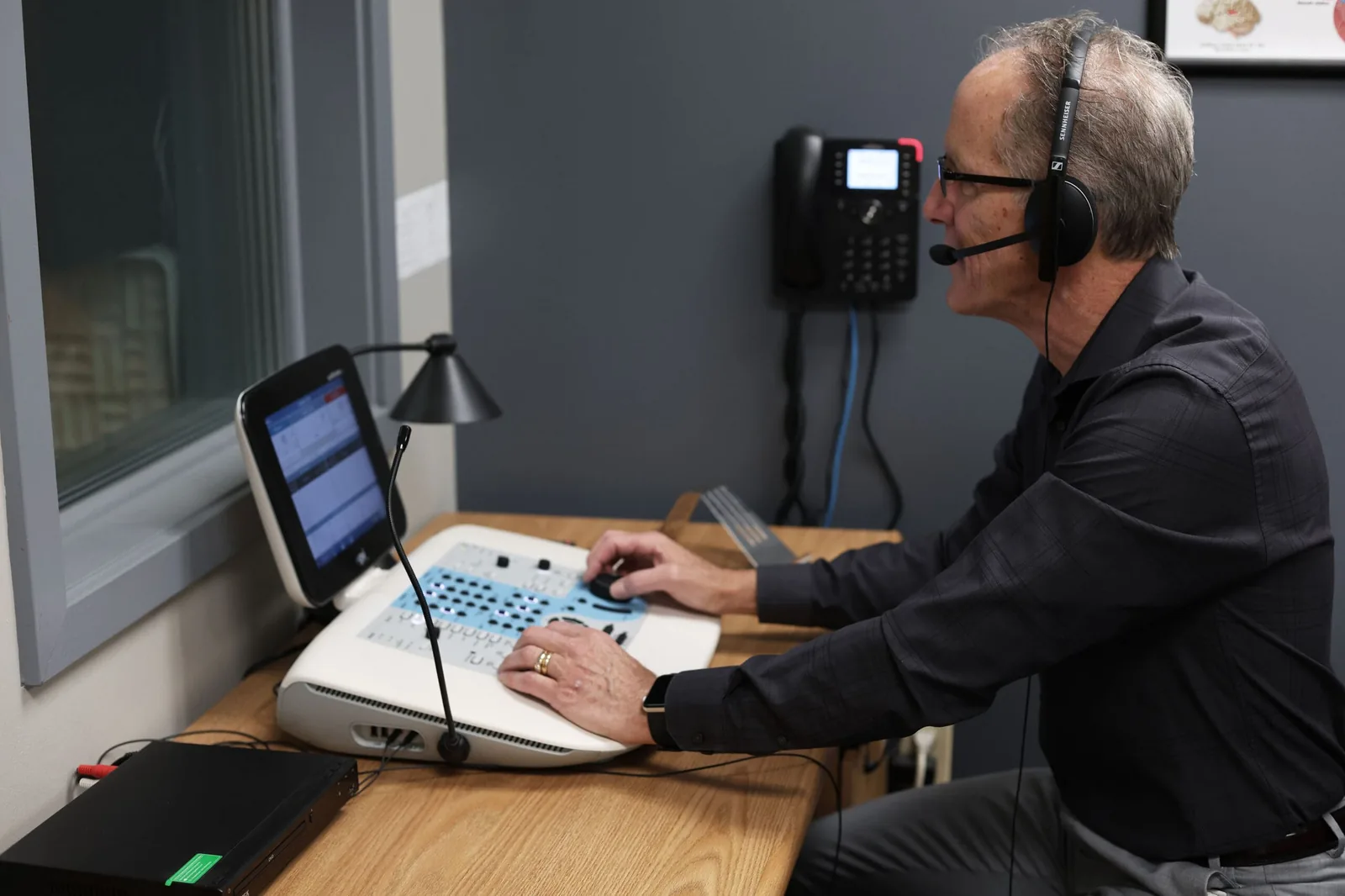 Audiologist consulting with patient about hearing aids at Ontario Hearing Center