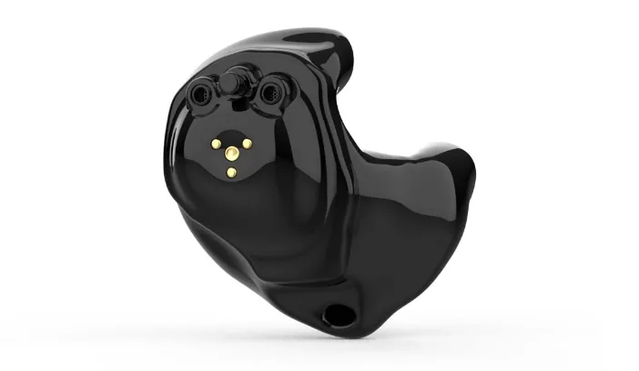 Black custom-molded in-ear hearing aid with gold connector pins