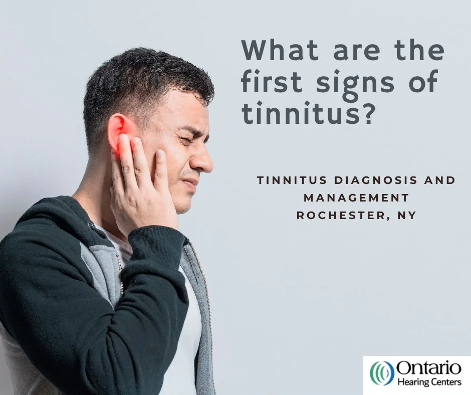 Man holding ear with What are the first signs of tinnitus text