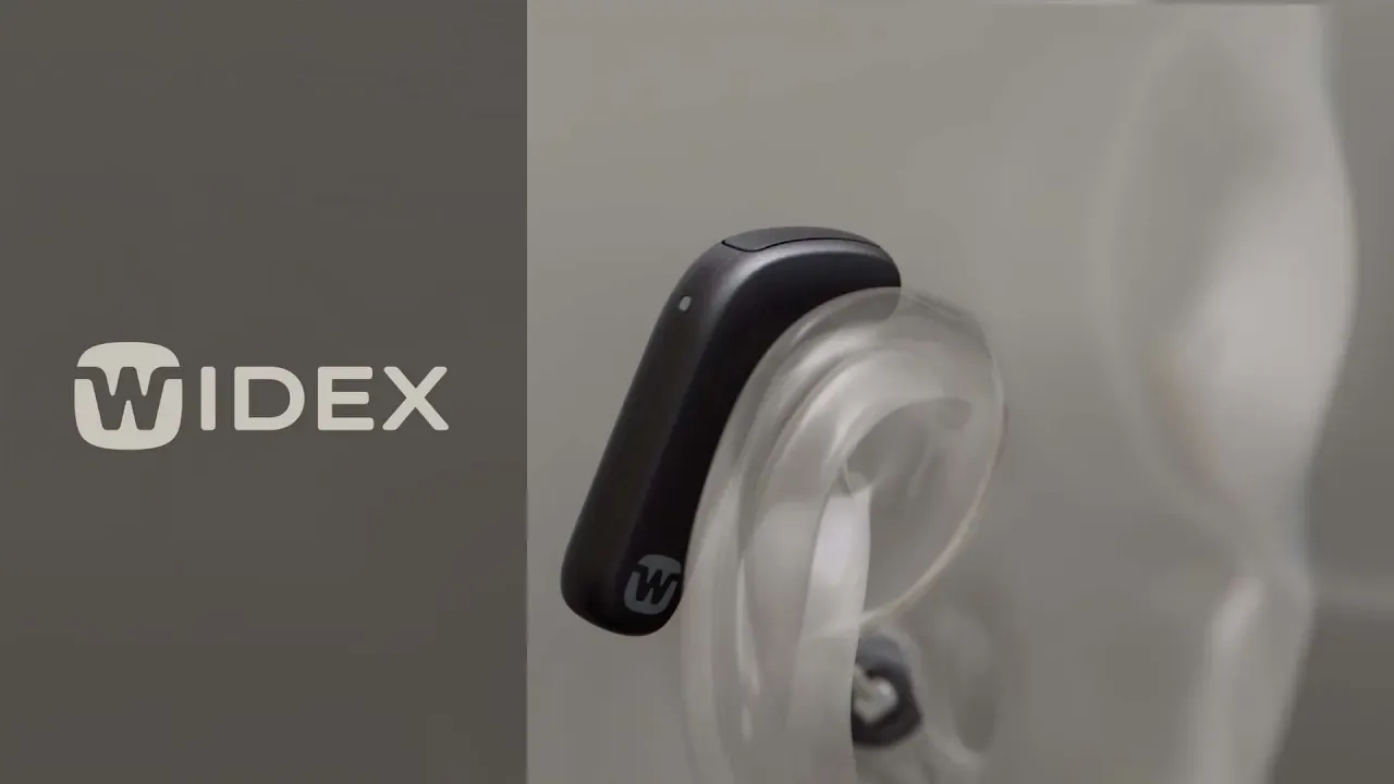 Widex black hearing aid on translucent ear model