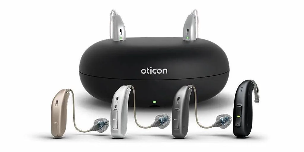 Oticon hearing aids in four colors with charging case