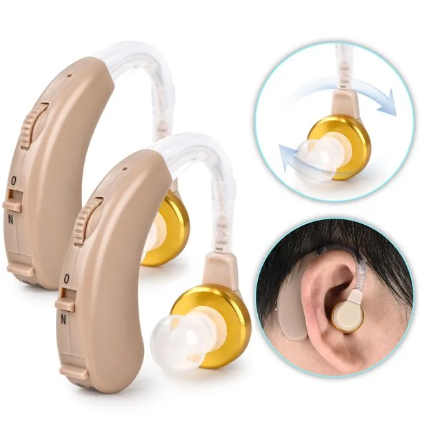 Beige hearing aids with volume dials and ear placement demonstration